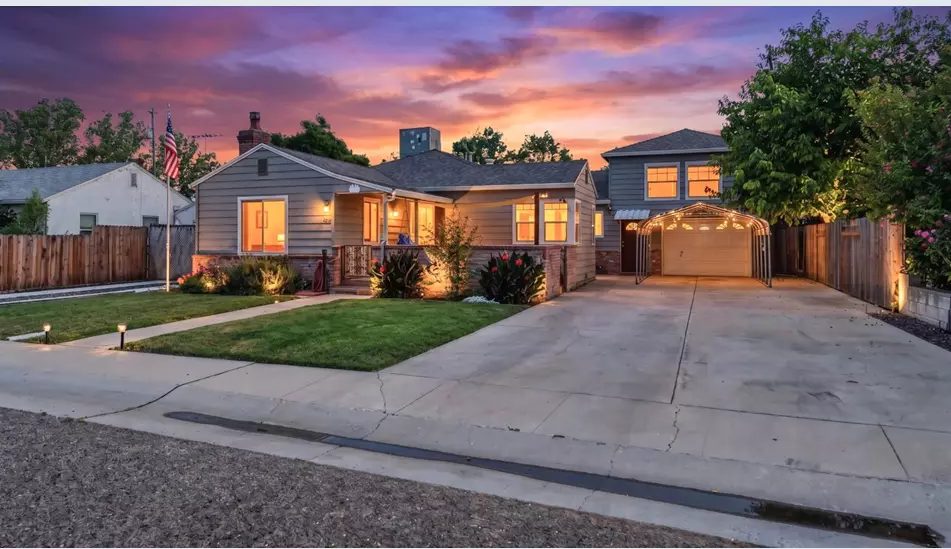 A Marysville home at twilight, represented by Valerie Nevis
